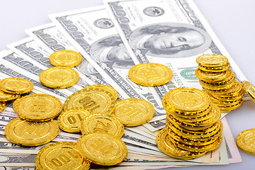 Image showing Gold coins and dollar banknotes