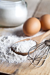 Image showing flour, eggs and kitchen utensil