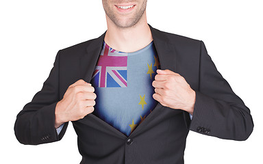 Image showing Businessman opening suit to reveal shirt with flag