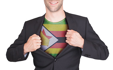 Image showing Businessman opening suit to reveal shirt with flag