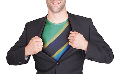 Image showing Businessman opening suit to reveal shirt with flag