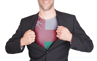 Image showing Businessman opening suit to reveal shirt with flag