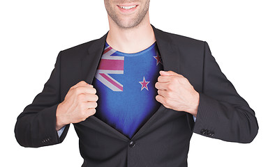 Image showing Businessman opening suit to reveal shirt with flag