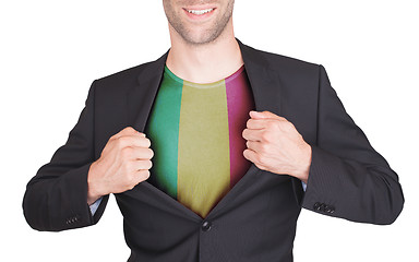 Image showing Businessman opening suit to reveal shirt with flag