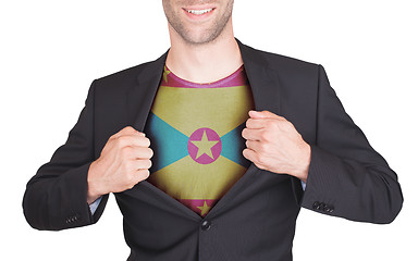 Image showing Businessman opening suit to reveal shirt with flag