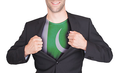 Image showing Businessman opening suit to reveal shirt with flag