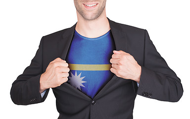 Image showing Businessman opening suit to reveal shirt with flag