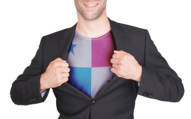 Image showing Businessman opening suit to reveal shirt with flag