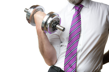 Image showing Businessman holding silver dumbbell