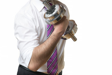 Image showing Businessman holding silver dumbbell