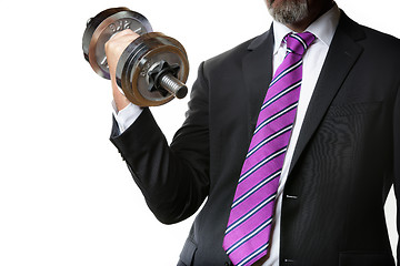 Image showing Businessman holding silver dumbbell