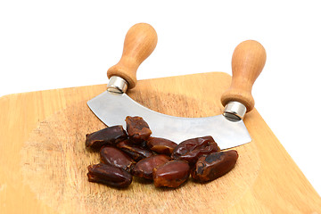 Image showing Whole dates with a rocking knife 