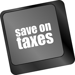 Image showing save on taxes word on laptop keyboard key, business concept