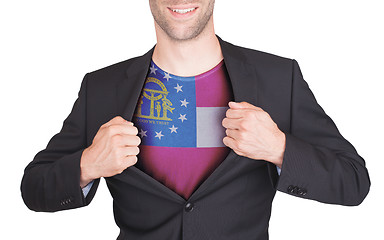 Image showing Businessman opening suit to reveal shirt with state flag