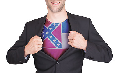 Image showing Businessman opening suit to reveal shirt with state flag