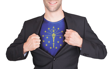 Image showing Businessman opening suit to reveal shirt with state flag