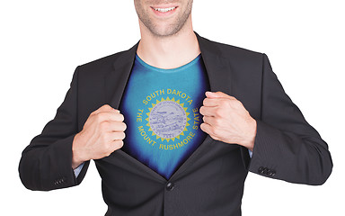 Image showing Businessman opening suit to reveal shirt with state flag