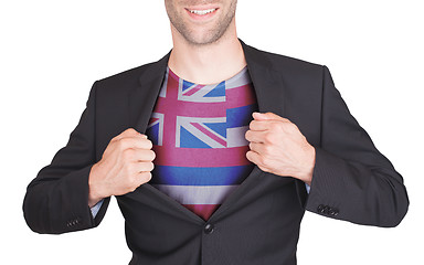 Image showing Businessman opening suit to reveal shirt with state flag