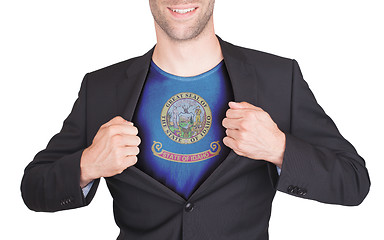 Image showing Businessman opening suit to reveal shirt with state flag