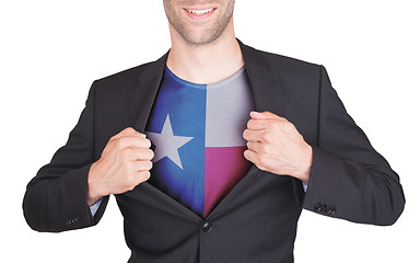 Image showing Businessman opening suit to reveal shirt with state flag