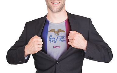 Image showing Businessman opening suit to reveal shirt with state flag