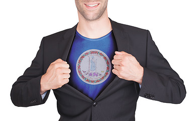 Image showing Businessman opening suit to reveal shirt with state flag