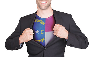 Image showing Businessman opening suit to reveal shirt with state flag