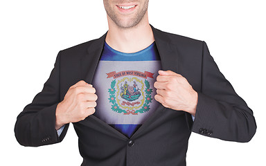 Image showing Businessman opening suit to reveal shirt with state flag