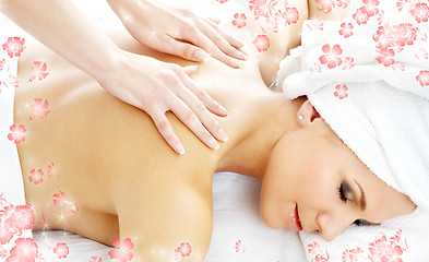 Image showing professional massage with flowers #2