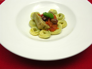 Image showing Tortellini  with tomato sauce, olives, basil  and artichoke