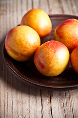 Image showing fresh nectarines in a plate 