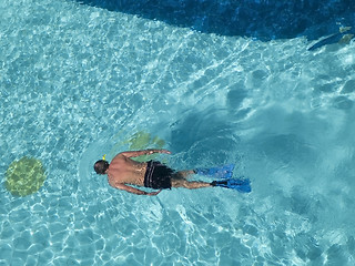 Image showing Man snorkeling in swimming-pool.