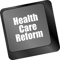 Image showing health care reform shown by health computer keyboard button