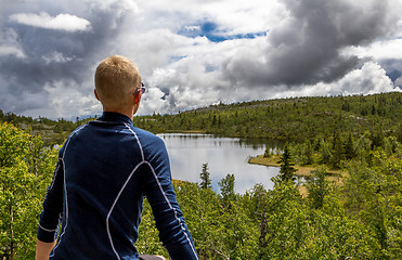 Image showing staring at lake 