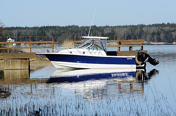 Image showing big white boat tied up at the seashore