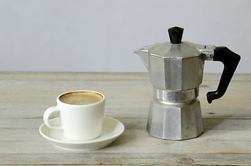 Image showing cup of coffee and percolator