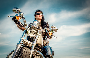 Image showing Biker girl on a motorcycle