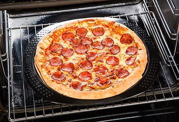 Image showing Pepperoni pizza in the oven.