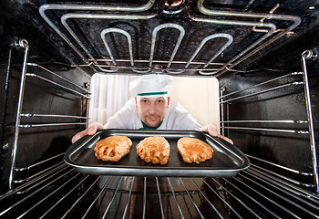 Image showing Chef cooking in the oven.