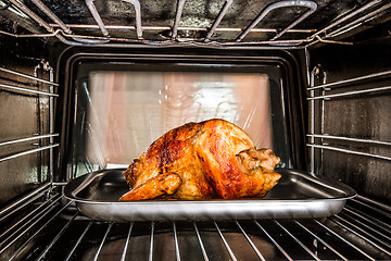 Image showing Roast chicken in the oven.