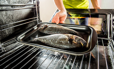 Image showing Cooking Dorado fish in the oven.