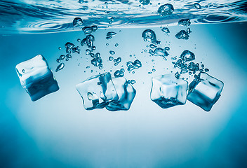 Image showing Ice cubes falling under water