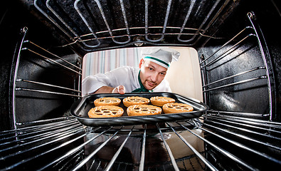 Image showing Chef cooking in the oven.