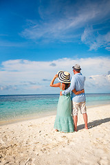 Image showing Vacation Couple walking on tropical beach Maldives.