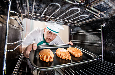 Image showing Chef cooking in the oven.