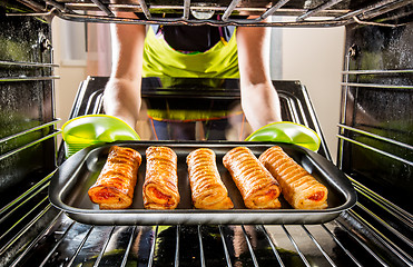 Image showing Cooking in the oven at home.