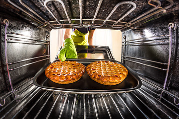 Image showing Cooking in the oven at home.