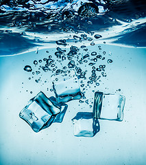 Image showing Ice cubes falling under water