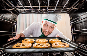 Image showing Chef cooking in the oven.