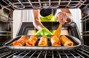 Image showing Cooking in the oven at home.